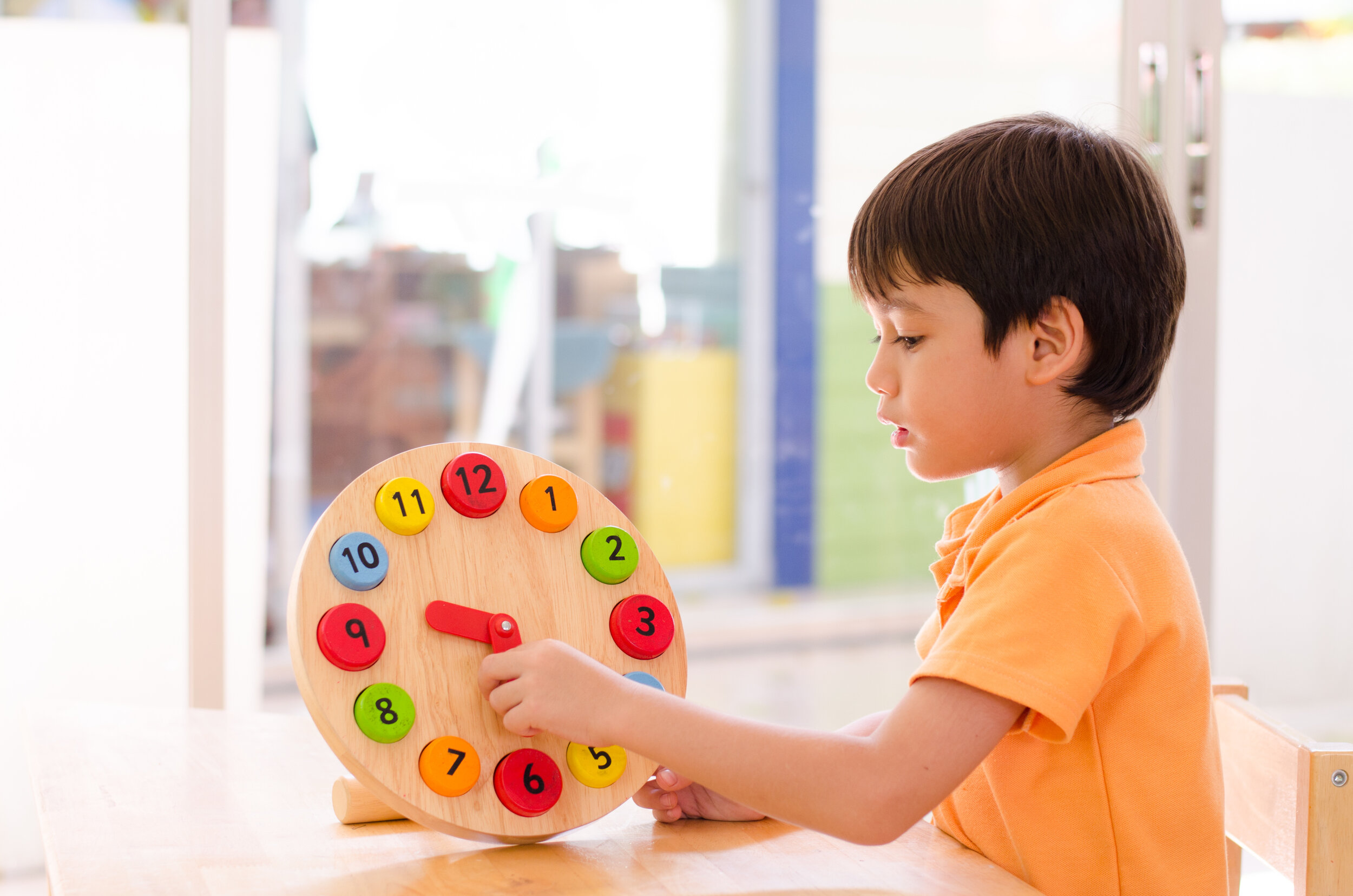 Preschooler engaged in educational activities guided by personalized educational consultant advice